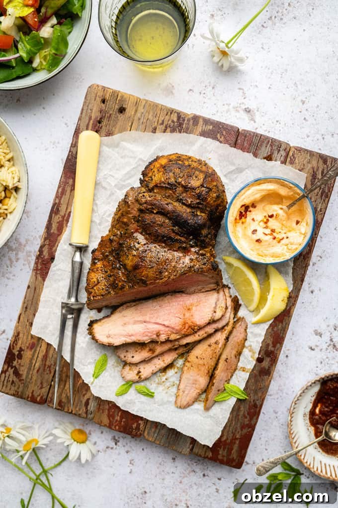 Marinated BBQ Boneless Leg of Lamb Recipe 3 Grilled boneless leg of lamb on a serving board