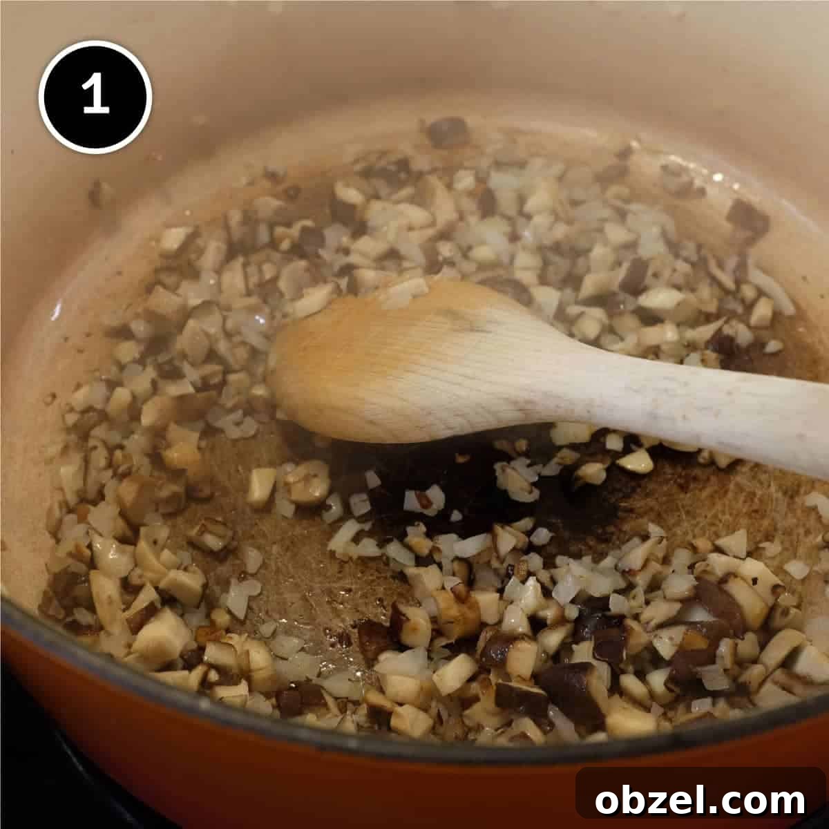 Stirring onion, mushroom and garlic in a large pan
