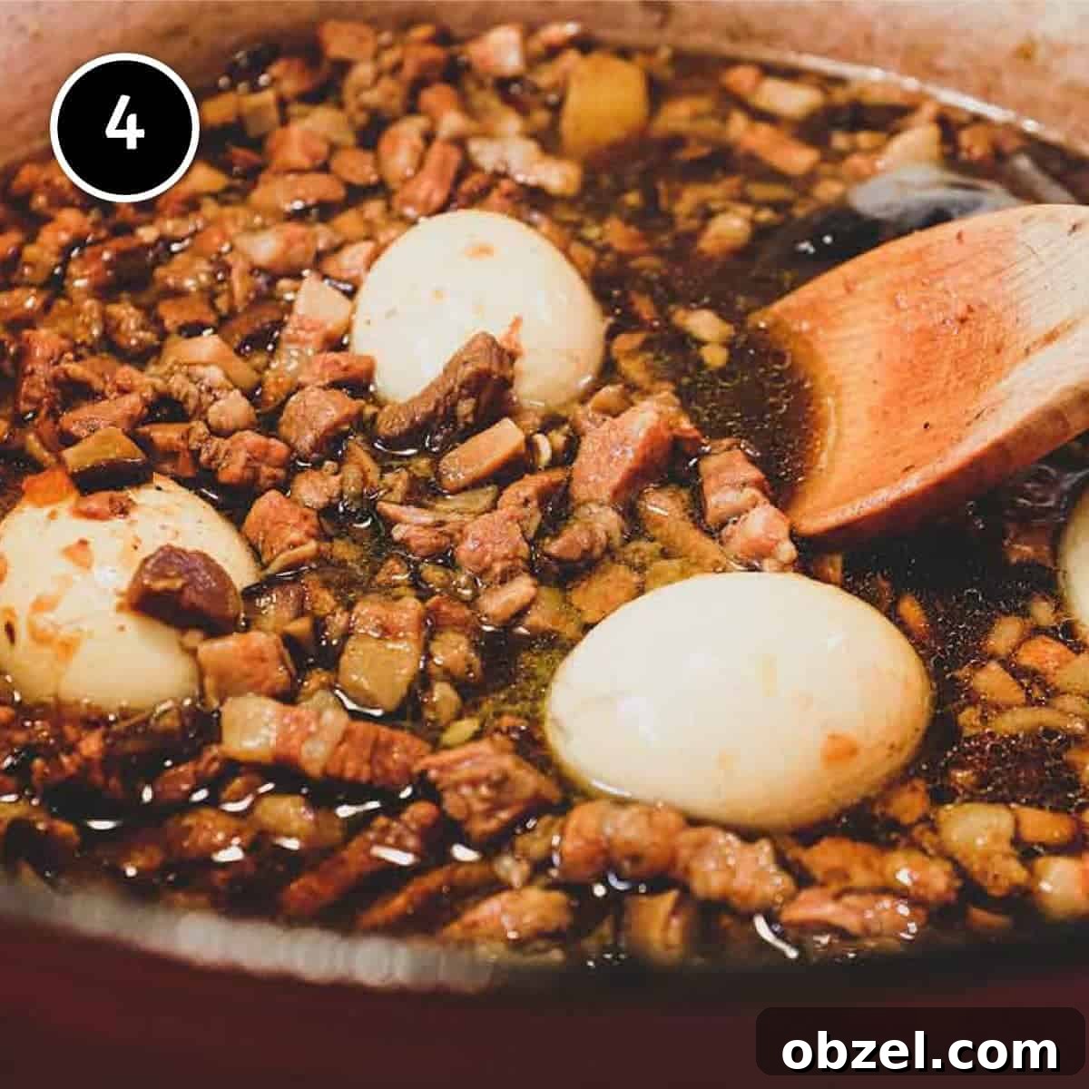Eggs cooking in a pork belly sauce 'lu rou fan'.