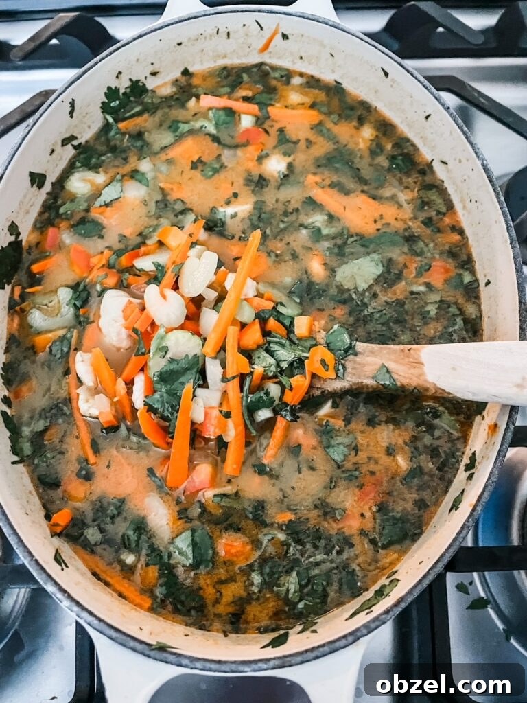 Creamy Chicken Coconut Curry Soup Recipe 3 The Healthy and Nourishing Chicken Curry in a stew pot - filled with veggies