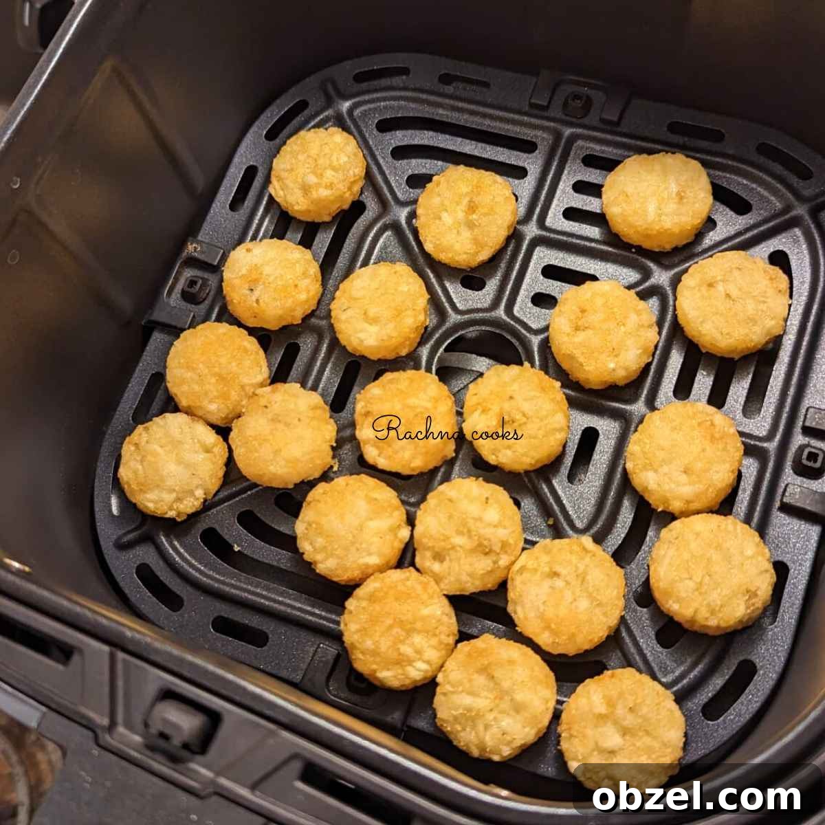 Air Fryer Ore-Ida Crispy Crowns Recipe 4 Ore Ida crispy crowns in air fryer basket ready for air frying