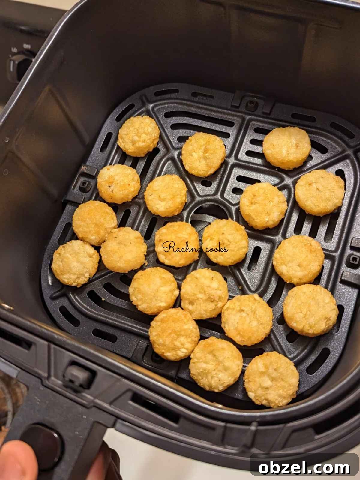 Air Fryer Ore-Ida Crispy Crowns Recipe 6 Ore Ida crispy crowns in air fryer basket ready for air frying