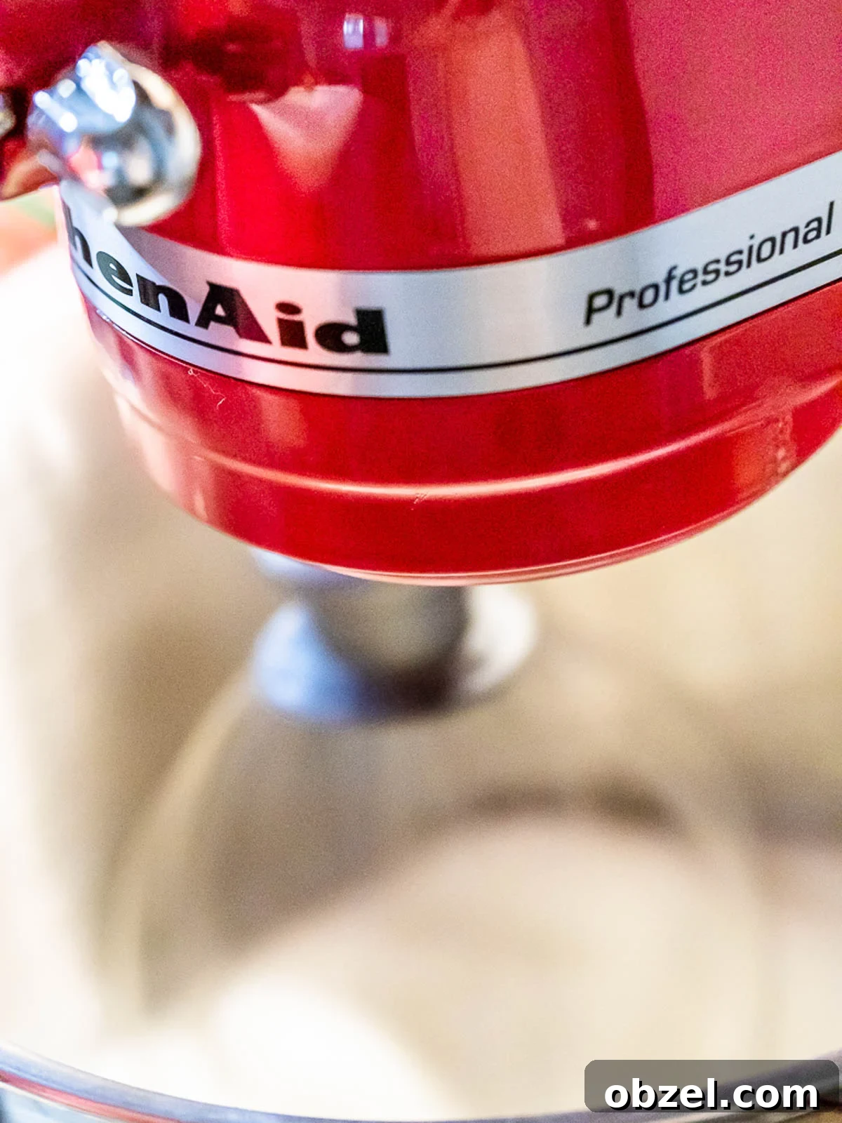 Bakery Style Swiss Roll Cake Recipe 4 Red KitchenAid stand mixer whisking eggs.