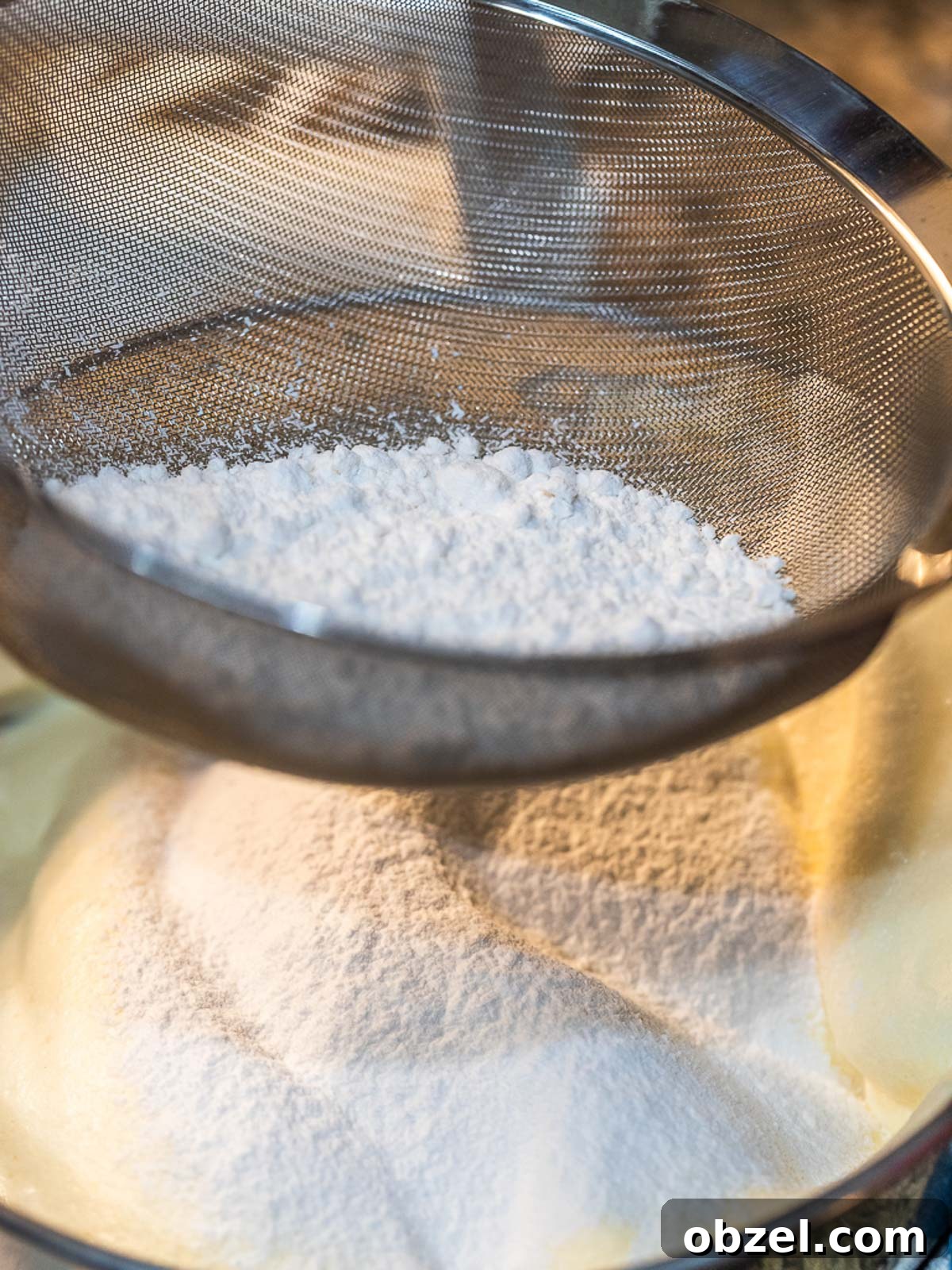 Bakery Style Swiss Roll Cake Recipe 7 Sifted flour into cake batter.