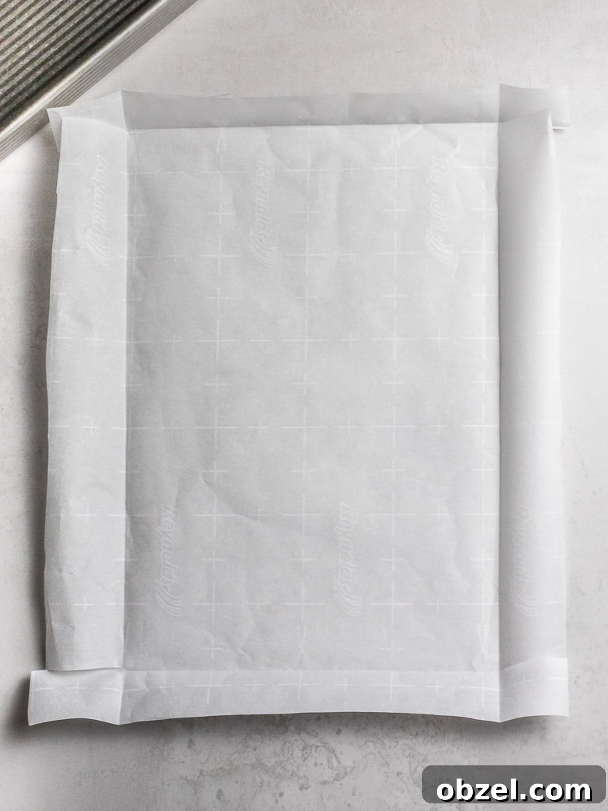 Bakery Style Swiss Roll Cake Recipe 8 Parchment paper folded.