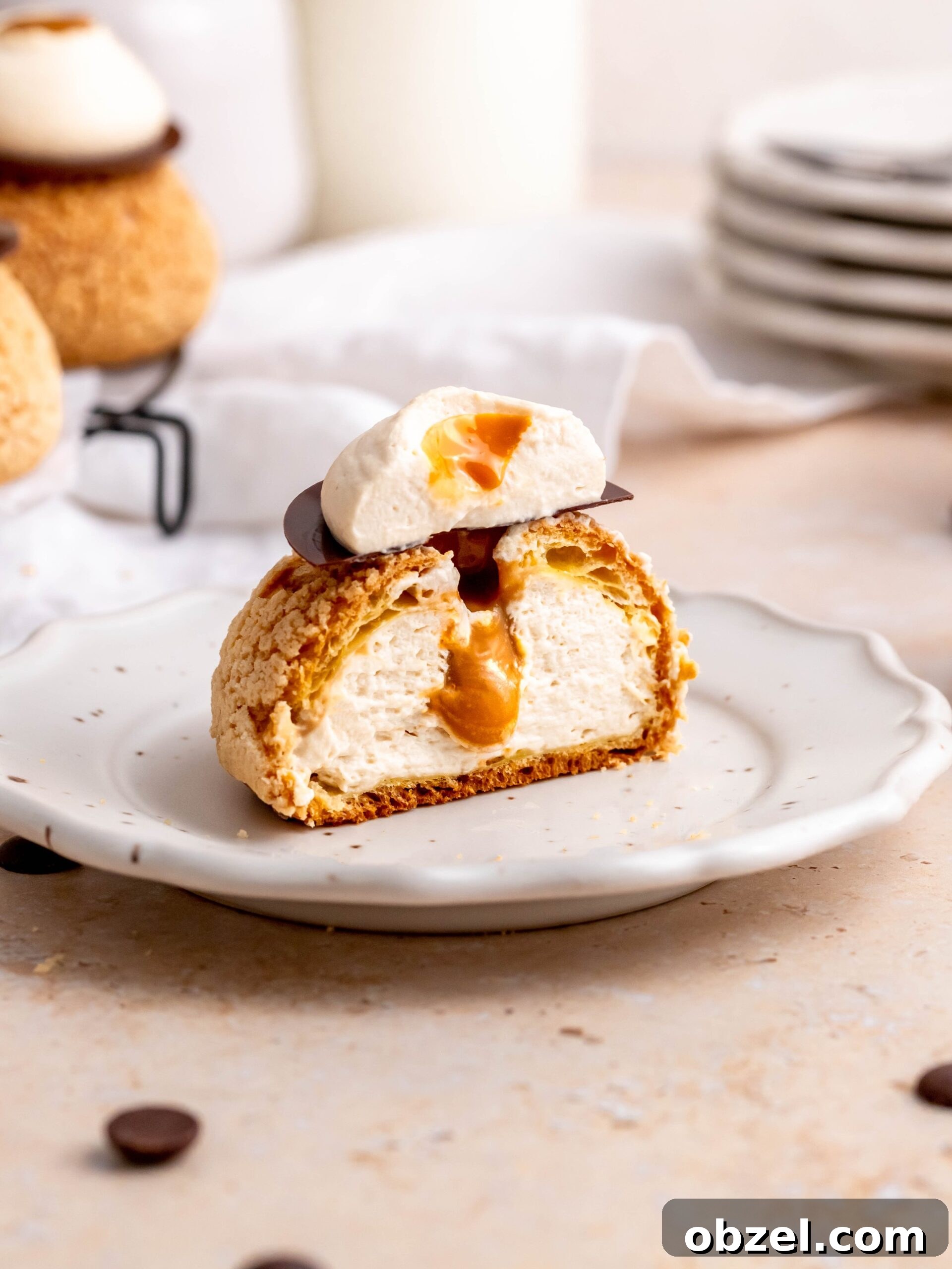 Coffee Choux au Craquelin with Dulce de Leche 2 Choux au Craquelin with Coffee and Salted Dulce de Leche on a plate