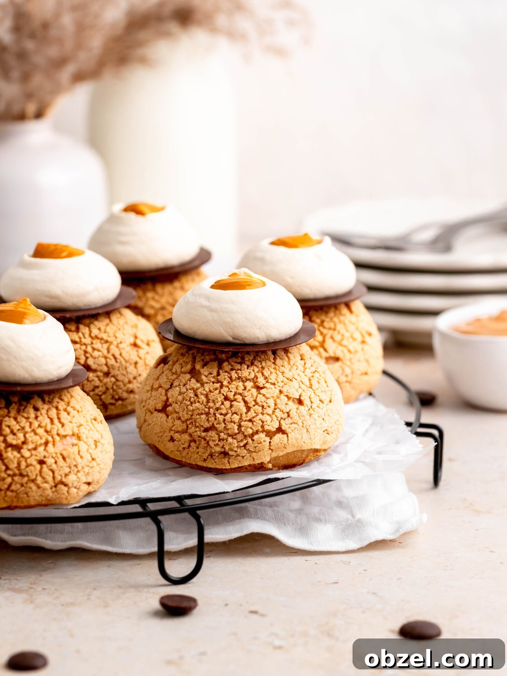 Coffee Choux au Craquelin with Dulce de Leche 3 Choux au Craquelin with Coffee and Salted Dulce de Leche on a tray.