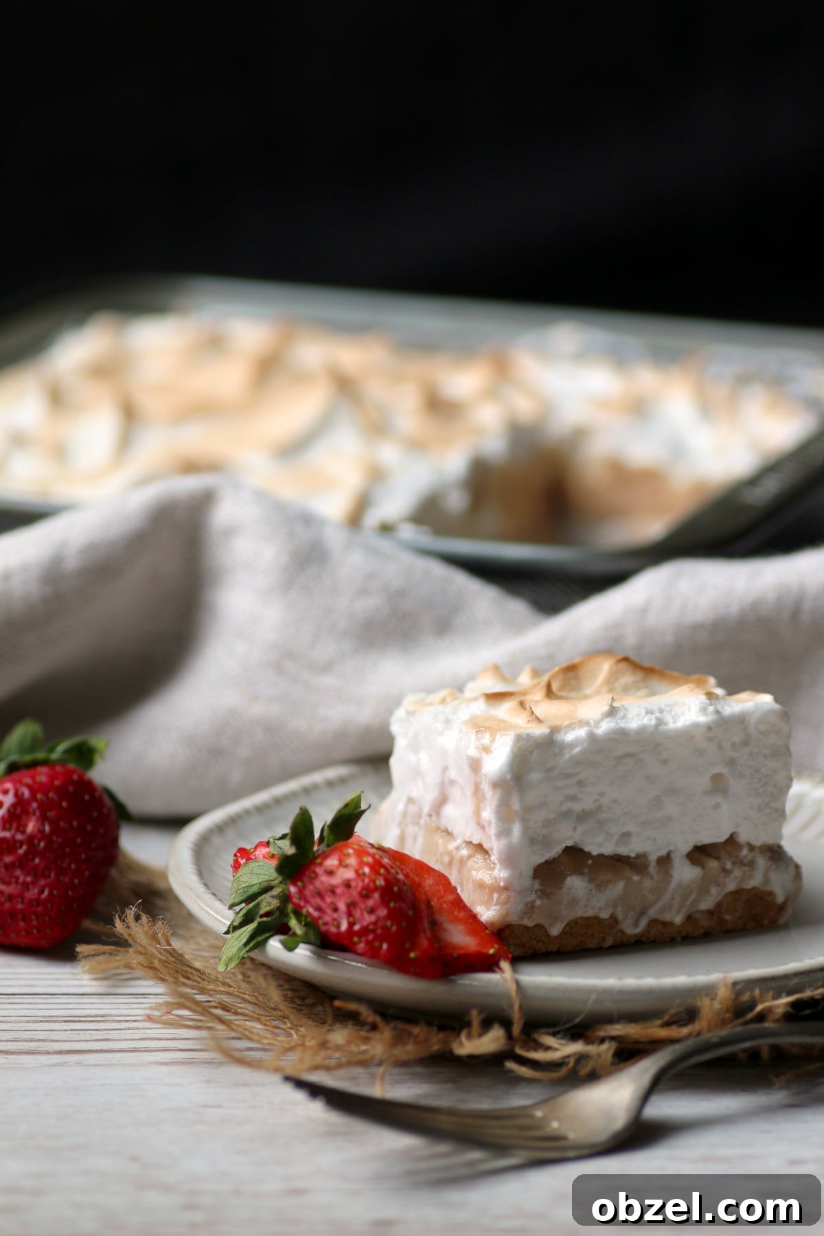 Strawberry Rhubarb Meringue Bars Recipe 3 Strawberry Rhubarb Meringue Square on a small white plate.