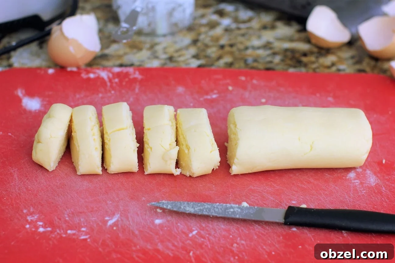 Pan de Yuca Warm Colombian Cheese Bread Rolls 4 cutting the dough into portions