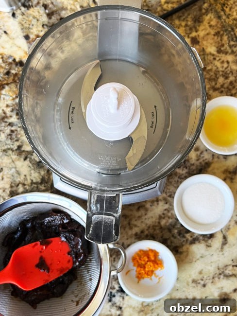How to Make Lekvar Prune Butter at Home 8 Cooked prunes and flavoring ingredients ready for blending.