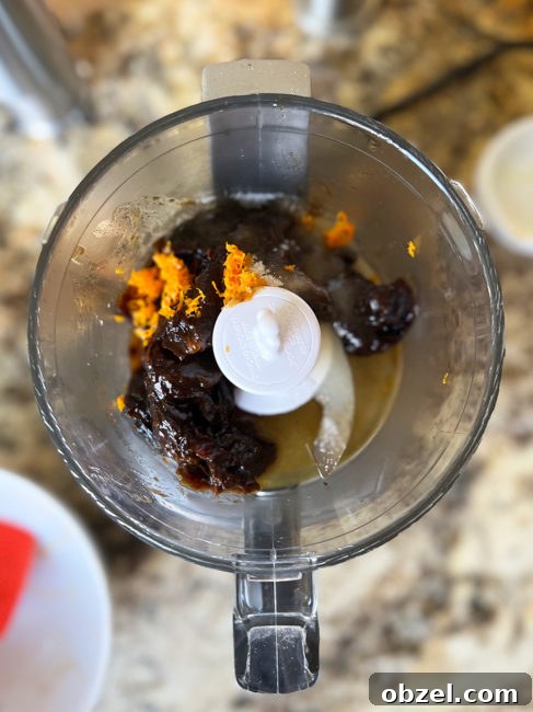 How to Make Lekvar Prune Butter at Home 9 Prune filling ingredients in a food processor ready to chop.
