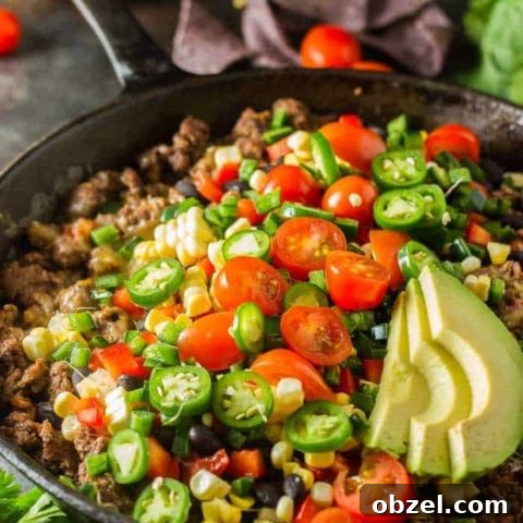 Healthy nachos in a cast iron skillet.