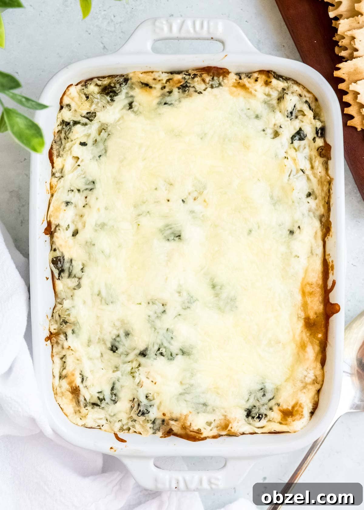 Creamy Spinach Artichoke Dip Recipe 10 baked spinach artichoke dip in a white dish