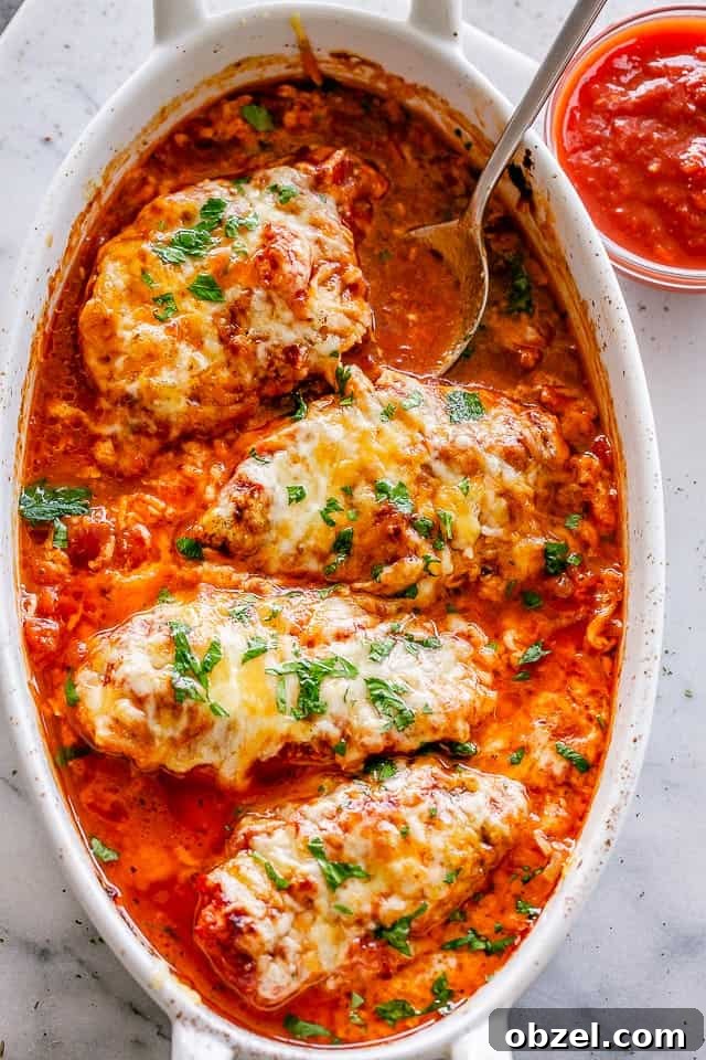 Baked Chicken breasts in baking dish with salsa.