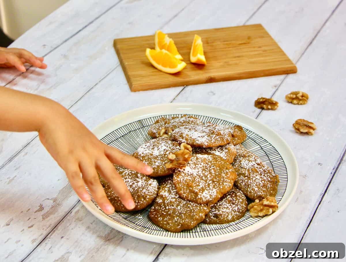 A child taking a cookie during the photo shoot.