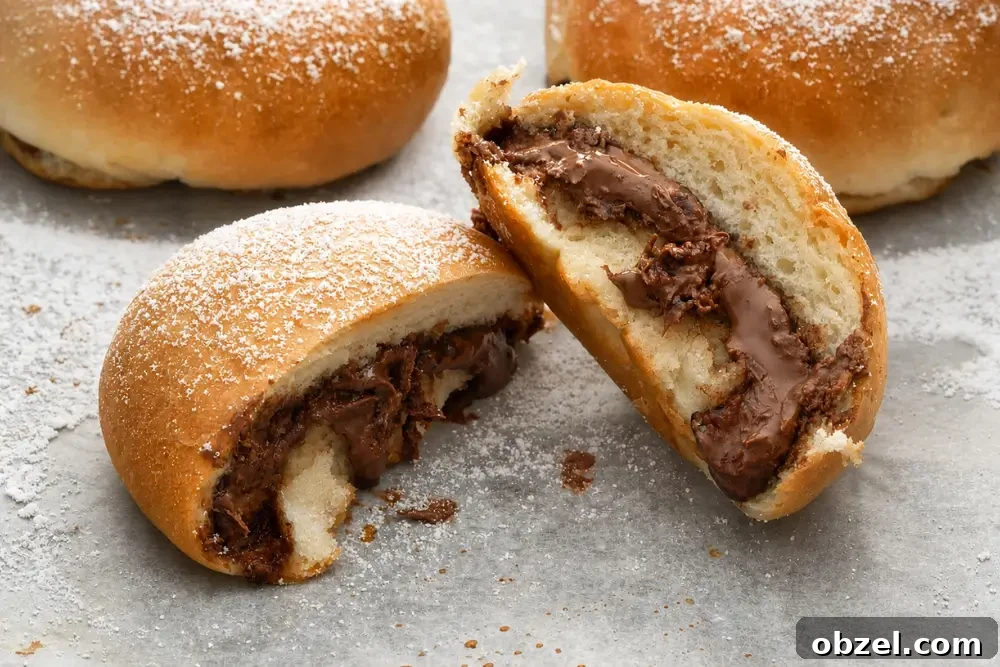 Baked Nutella Iris dusted with icing sugar and filled with creamy chocolate hazelnut spread.