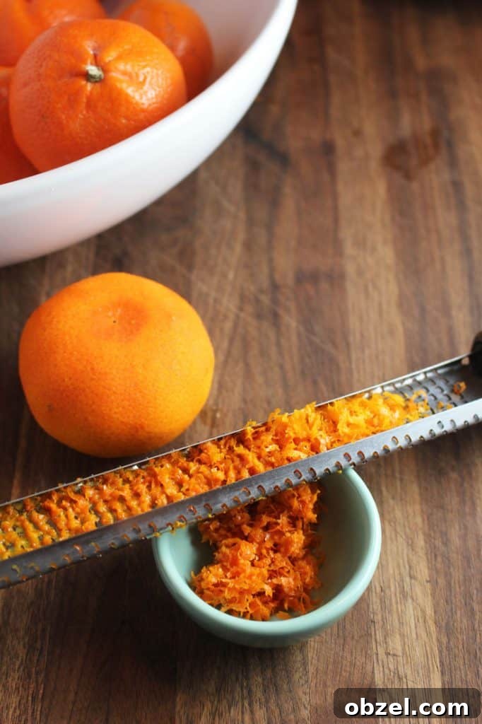 Mandarin Orange Greek Yogurt Muffins 5 Zest of a mandarin orange on a microplane zester