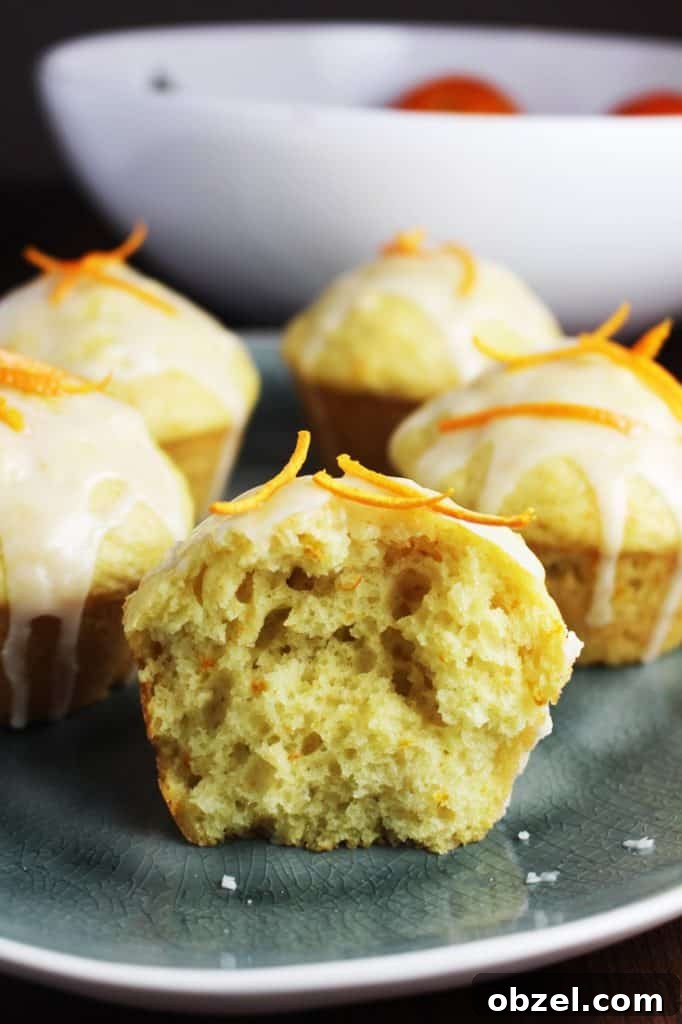 Mandarin Orange Greek Yogurt Muffins 7 Inside closeup of a mandarin orange muffin on a plate