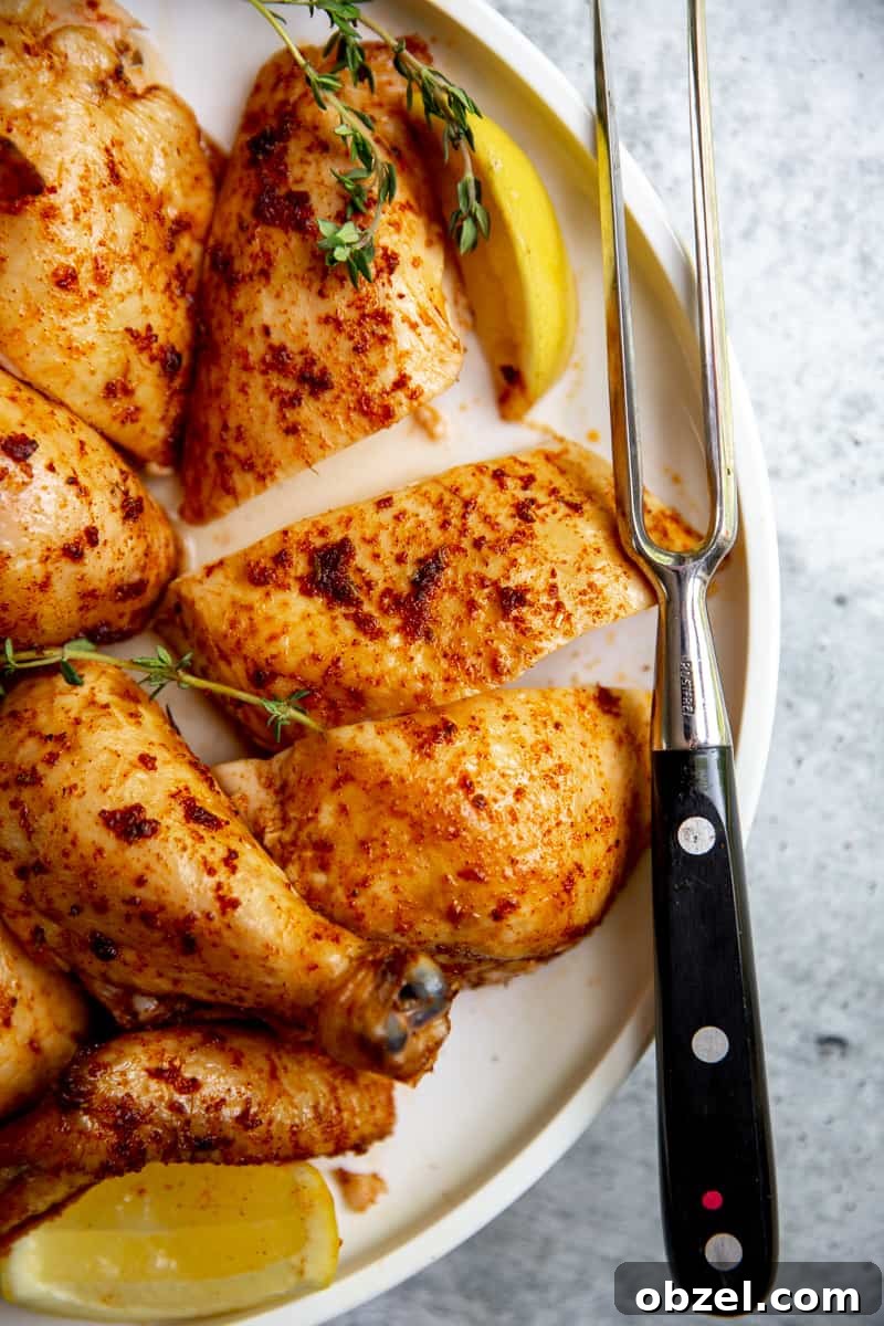 Traeger Smoked Whole Chicken Recipe 11 Savory and juicy smoked chicken on a plate.