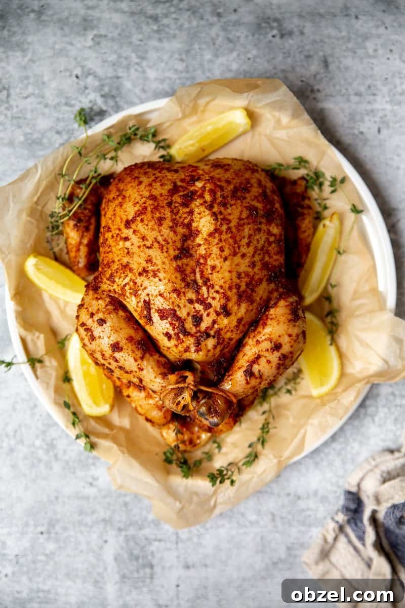 Traeger Smoked Whole Chicken Recipe 9 Whole smoked chicken on a platter.