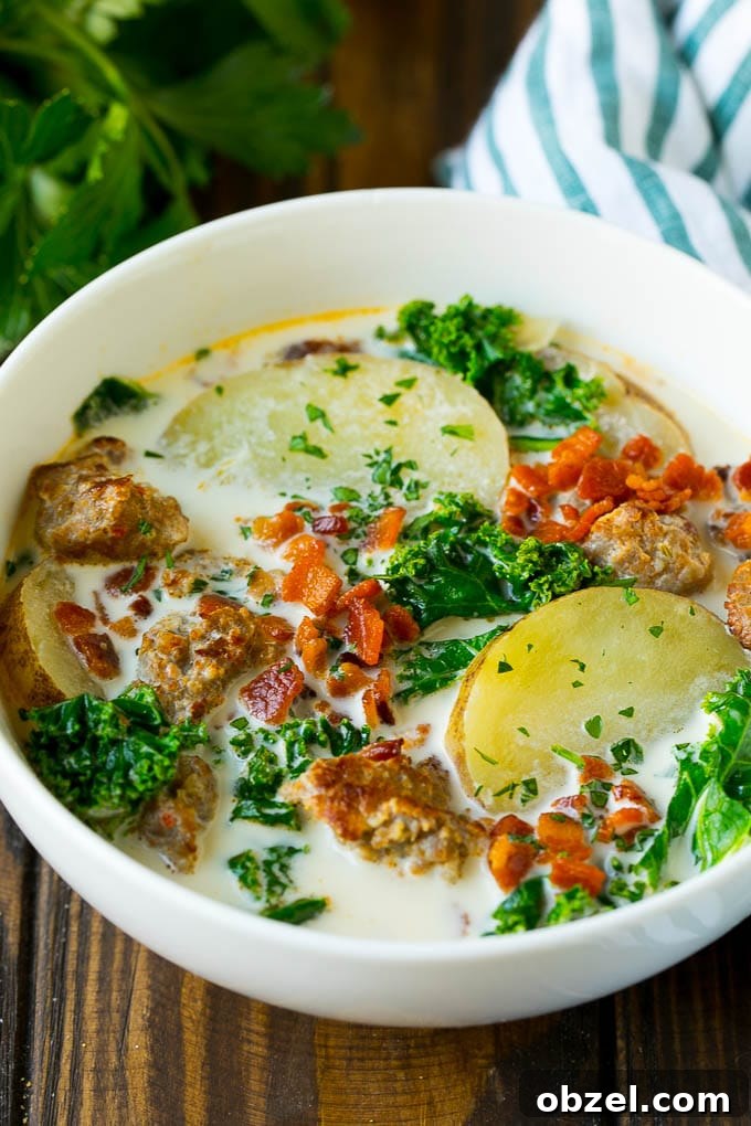 Zuppa Toscana Soup Recipe with Sausage and Kale 4 A bowl of zuppa toscana soup with sausage, potatoes, bacon and kale.