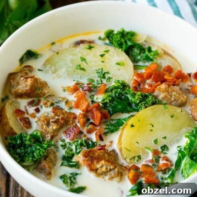 Zuppa Toscana Soup Recipe with Sausage and Kale 9 A bowl of zuppa toscana soup with sausage, potatoes, bacon and kale.