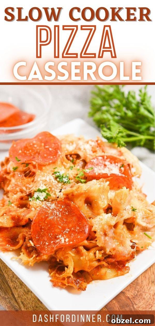 Crock Pot Pizza Casserole with Pasta and Pepperoni 9 A bowl of pizza casserole, garnished with parsley.