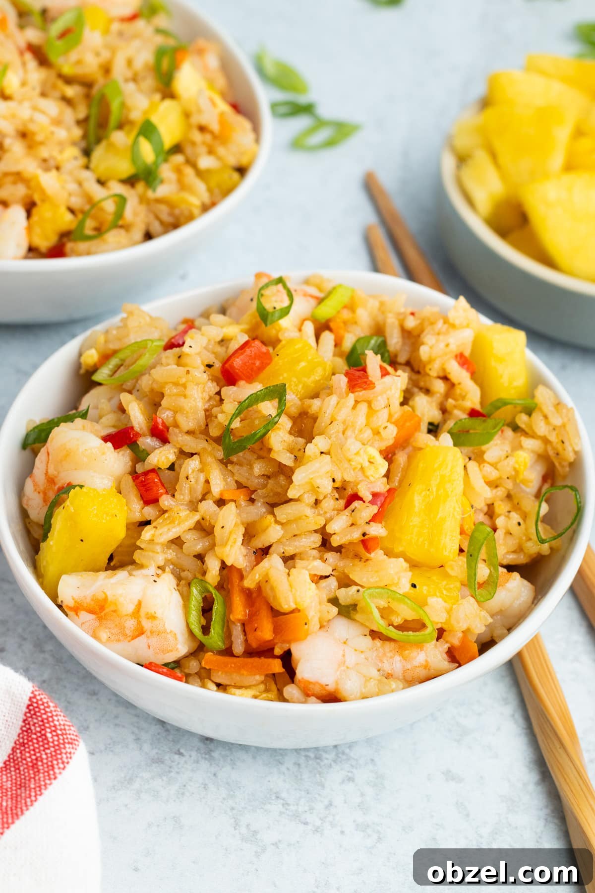 Pineapple Shrimp Fried Rice Recipe 13 Close-up of shrimp pineapple fried rice in a small white bowl.