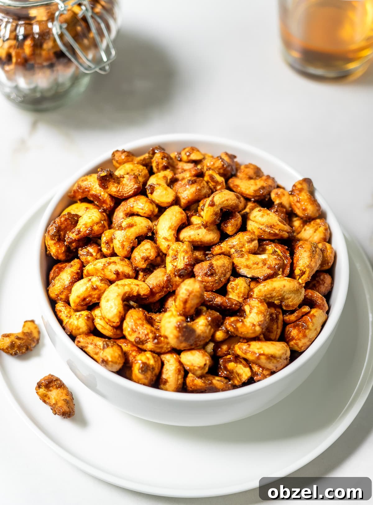 Bowl filled with roasted curry cashews.