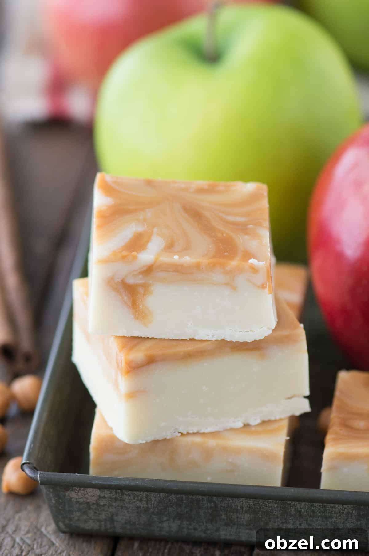 Pieces of caramel apple fudge in a metal tray