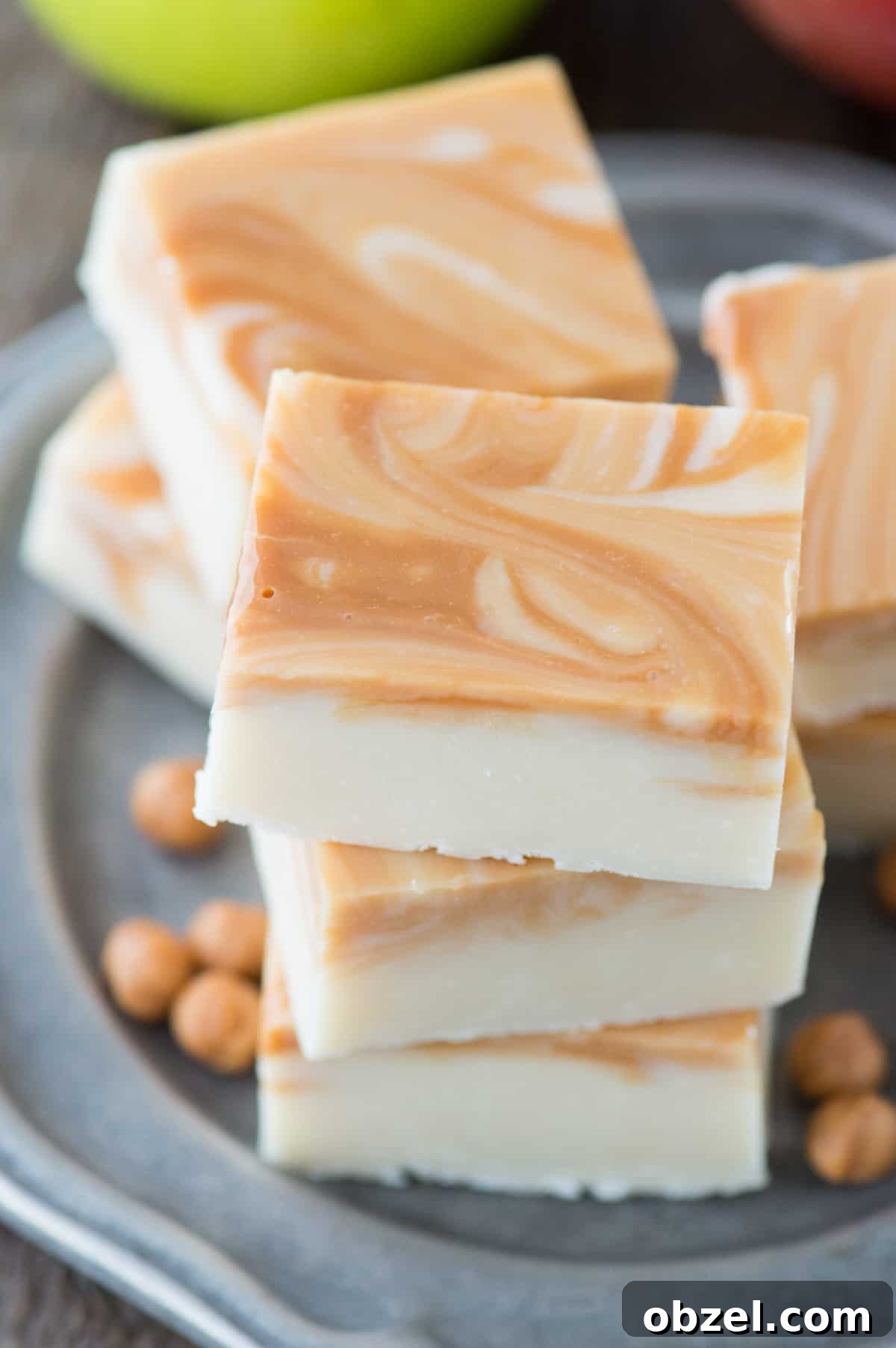 Pieces of caramel apple fudge on a metal plate