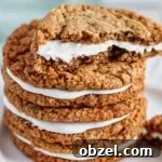 half of an oatmeal creme pie stacked on top of two more.