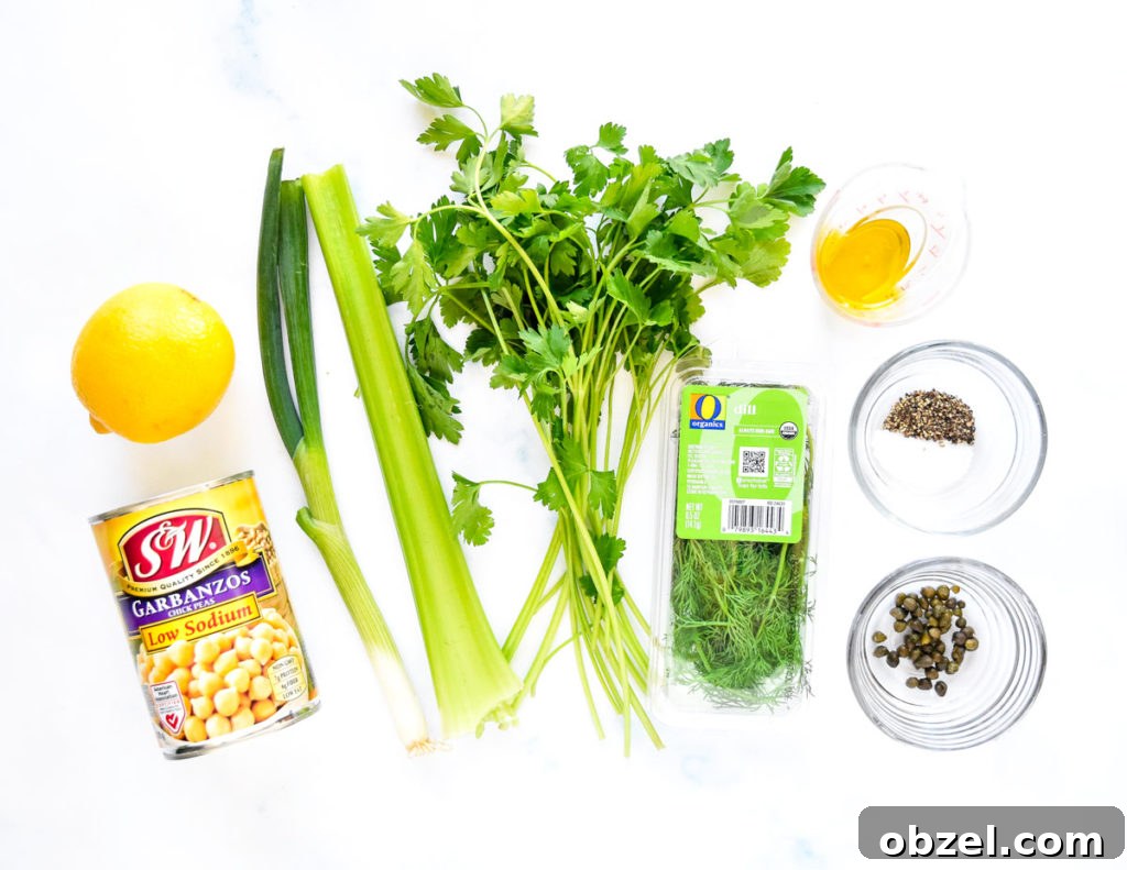 Lemony Herbed Mashed Chickpea Salad Recipe 5 ingredients laid out before chopping to make the herby lemon mashed chickpea salad.