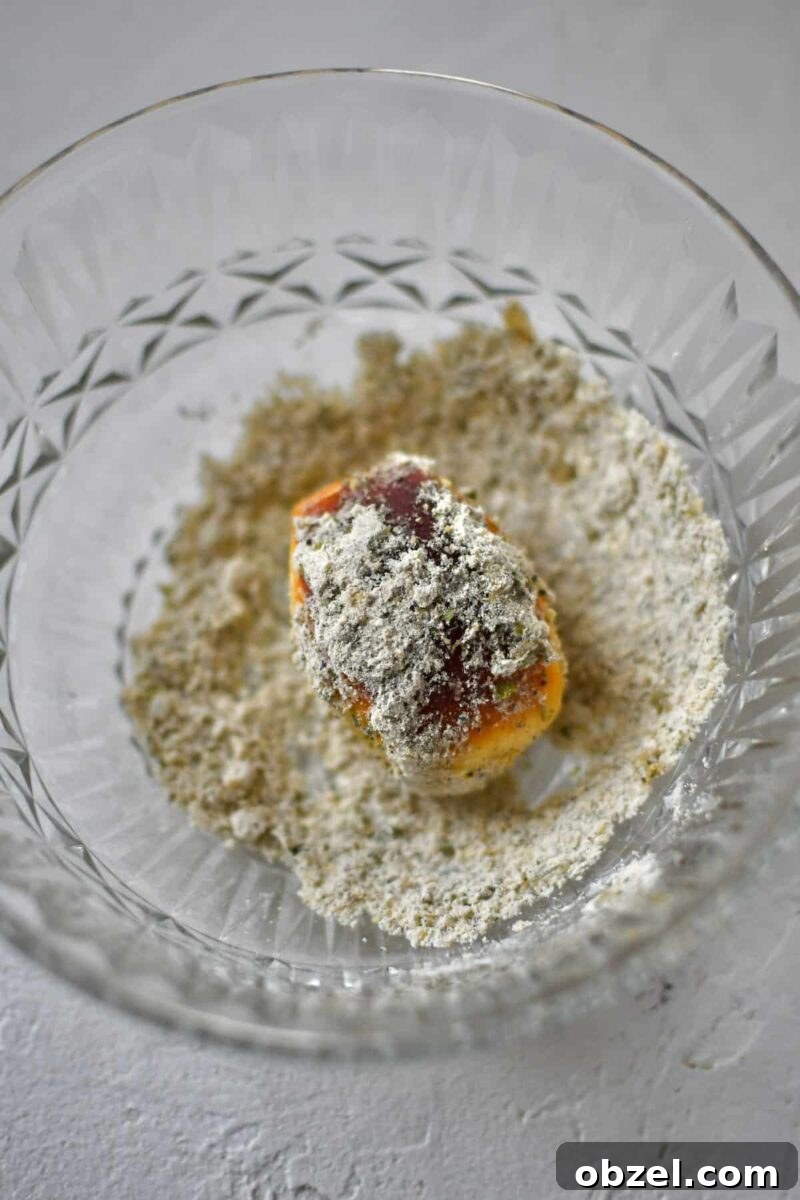 Dusting some of the pretzel bites with truffle parmesan seasoning.