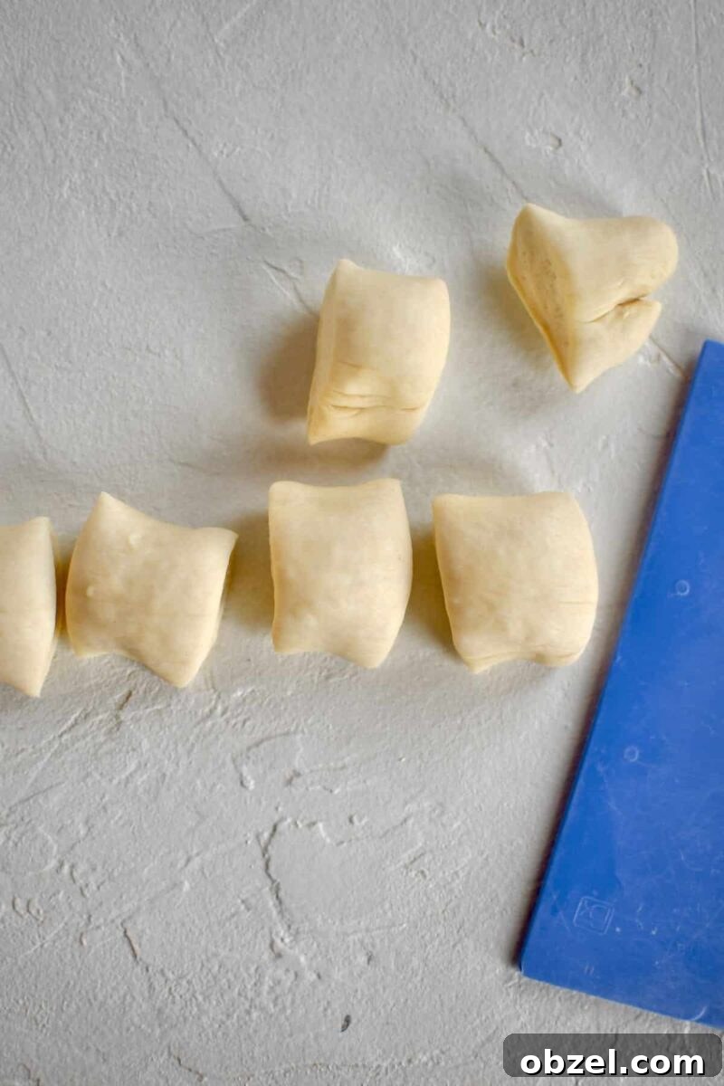 Proved dough rolled out and cut into pretzel bites.