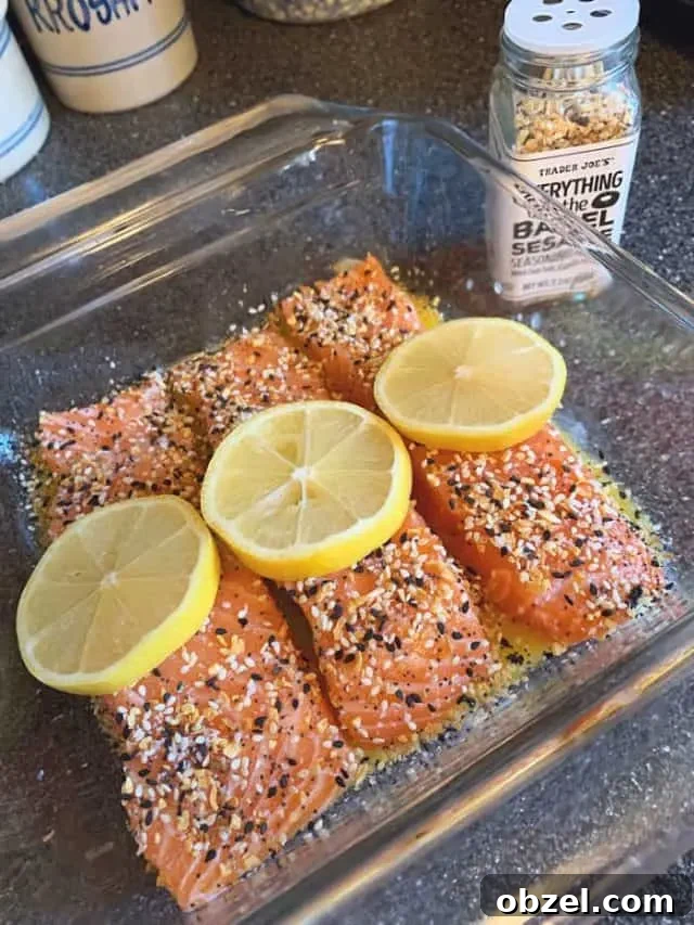 Lemon Butter Salmon with Everything Seasoning 4 salmon in pan ready to bake