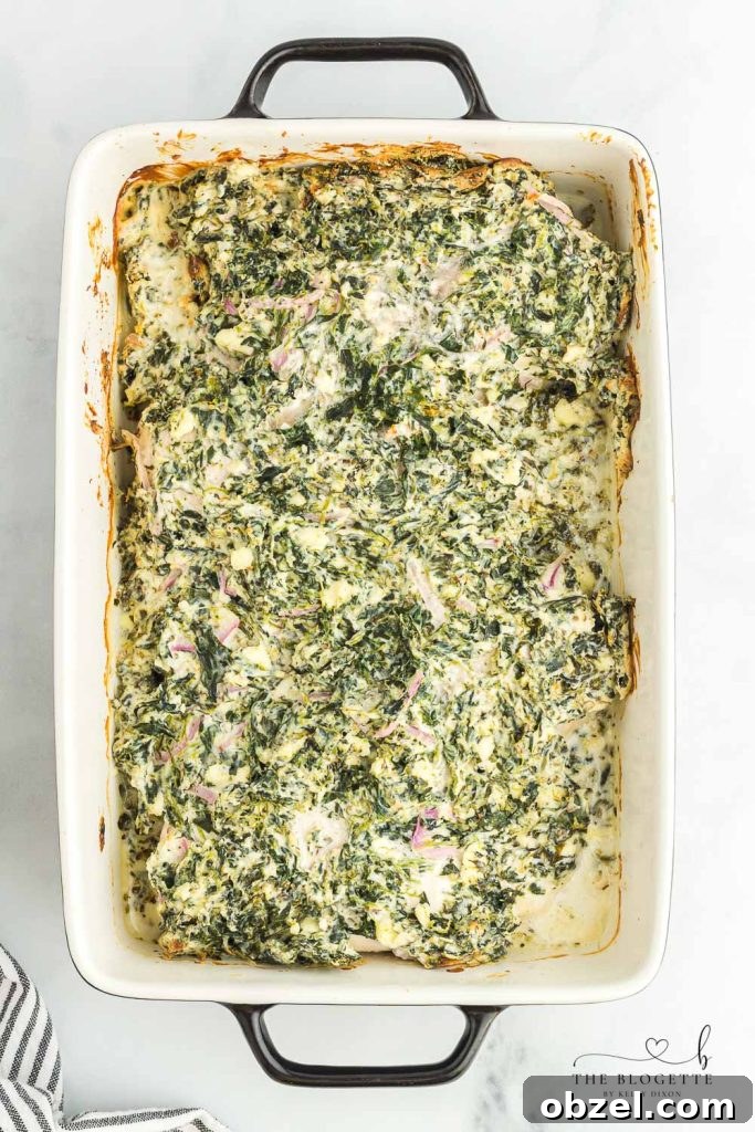 Creamy Spinach Dip Chicken Bake 5 Creamy spinach mixture spread over chicken breasts before baking