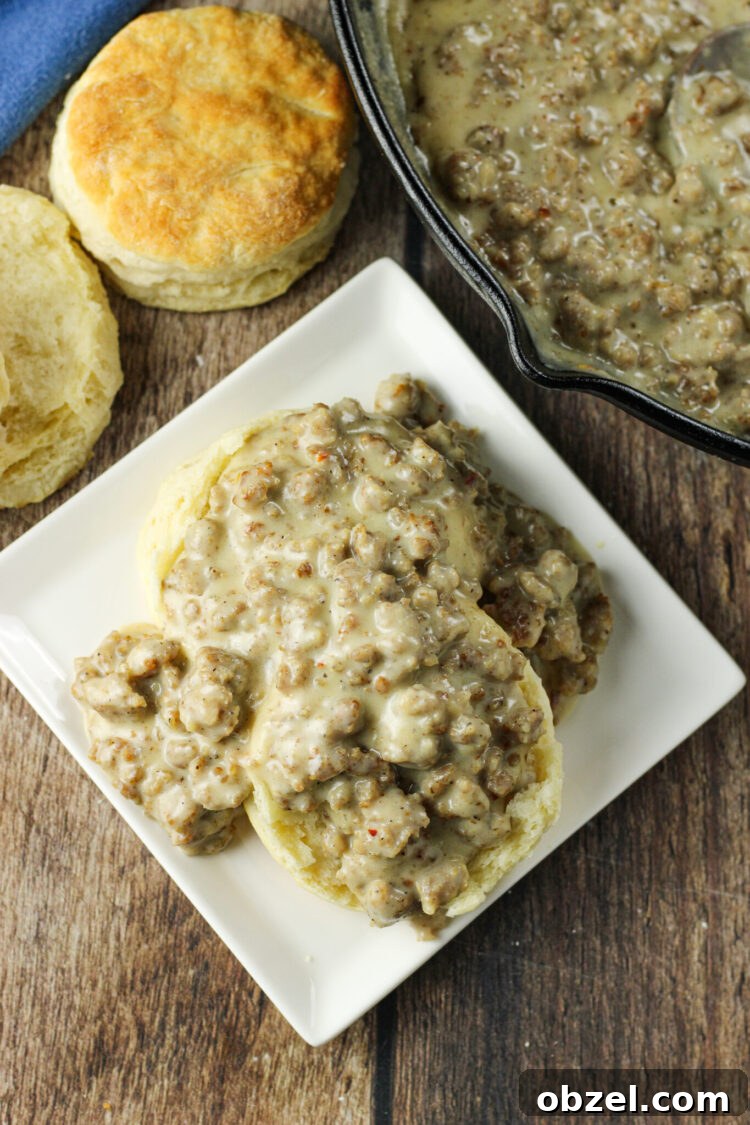 Easy sausage gravy served over warm biscuits biscuits covered in gravy