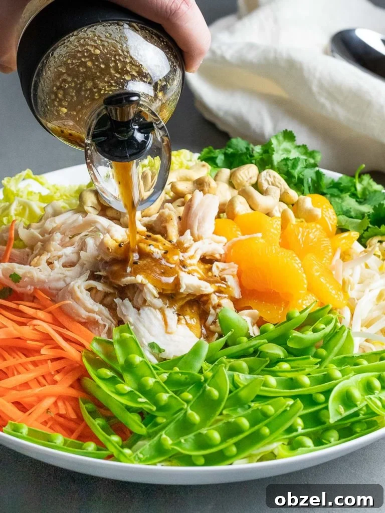Chinese Chicken Salad with Sesame Ginger Dressing 10 healthy chinese chicken salad with peas, mandarin oranges, carrots, and dressing