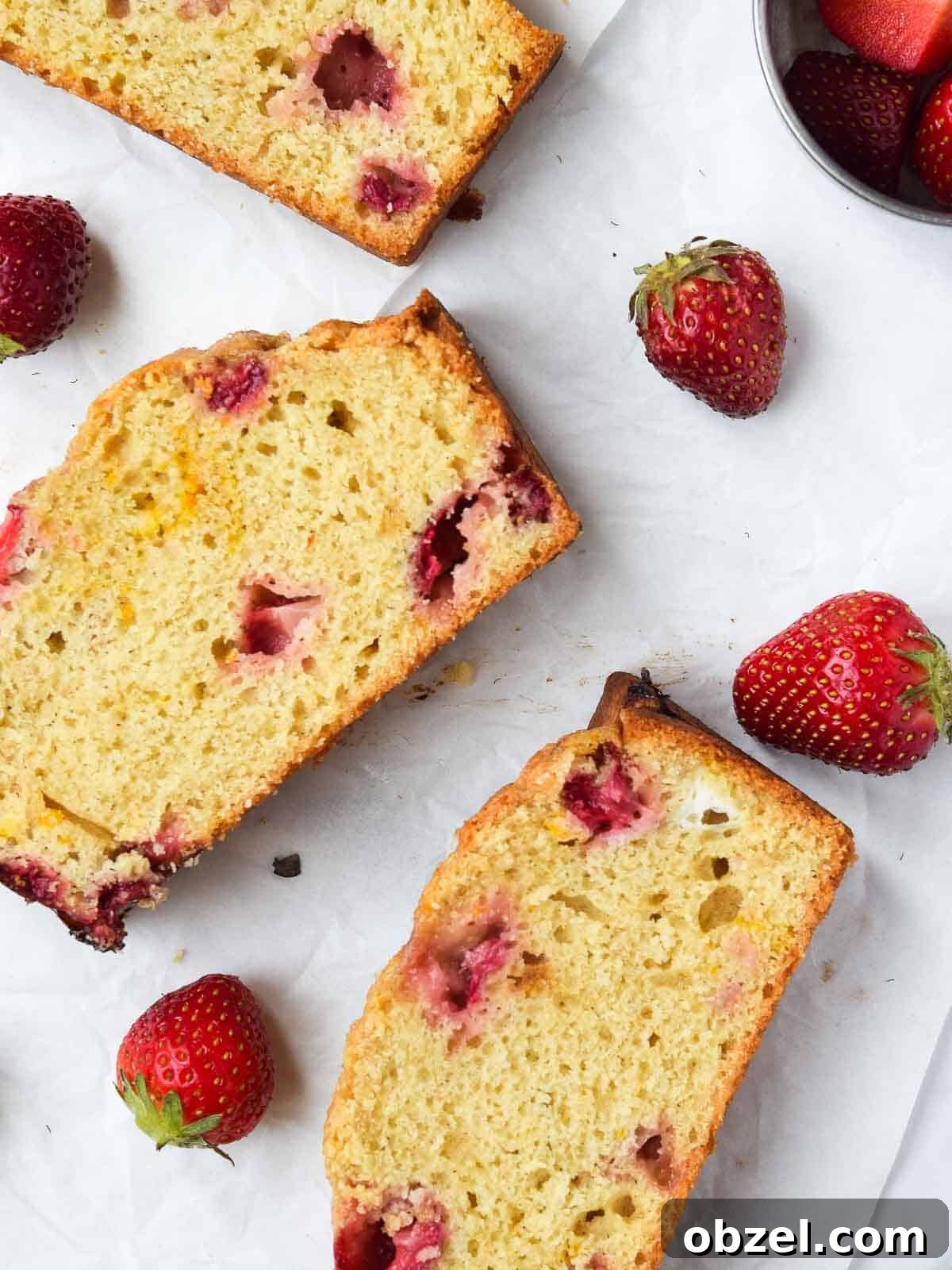 Fresh Buttermilk Strawberry Bread Recipe 3 Slices of strawberry bread spread out on wax paper.