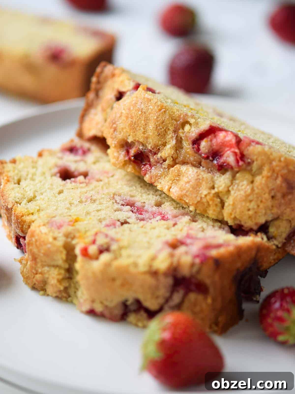Fresh Buttermilk Strawberry Bread Recipe 8 Close-up of sliced strawberry bread on a white plate.