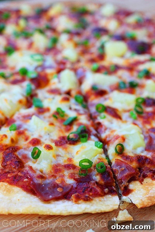BBQ Ham and Pineapple Pizza with Tangy Sauce 3 BBQ Ham and Pineapple Pizza – Pop in this easy, cheesy ham and pineapple pizza with barbecue sauce for a quick weeknight dinner!