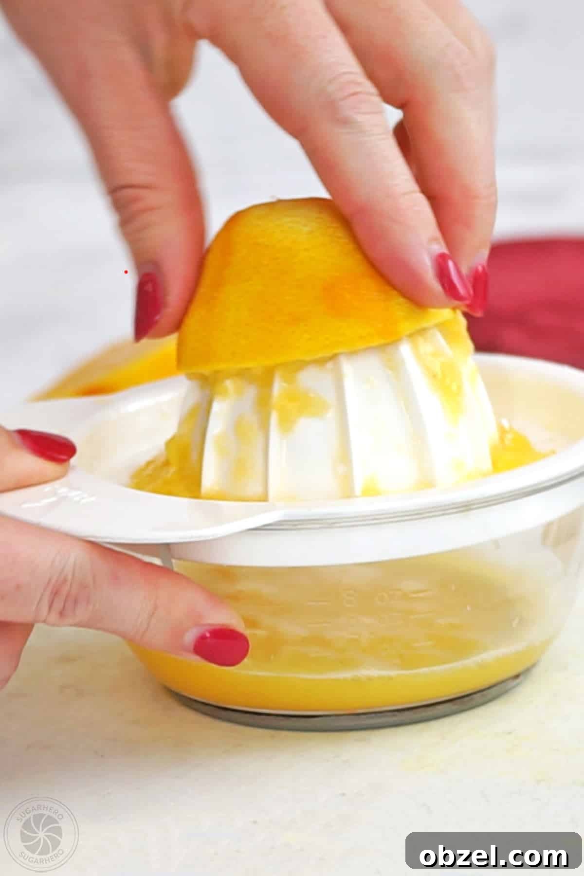 Cranberry Orange Sauce Recipe 8 Hand juicing an orange.