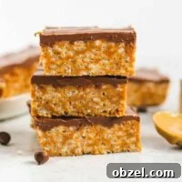 Healthier scotcheroo bars stacked 3 high.