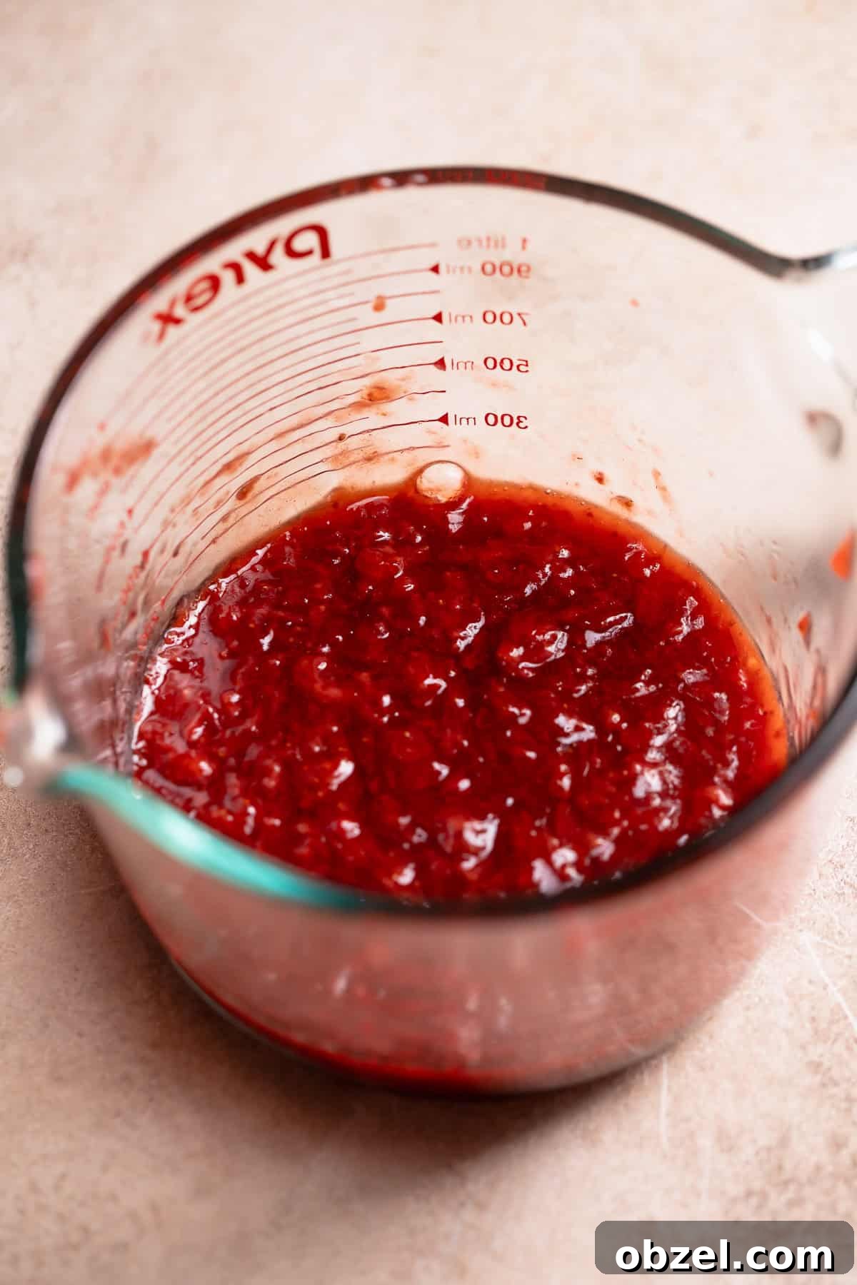 Strawberry Matcha Cinnamon Rolls Recipe 3 Strawberry jam filling in a glass bowl.
