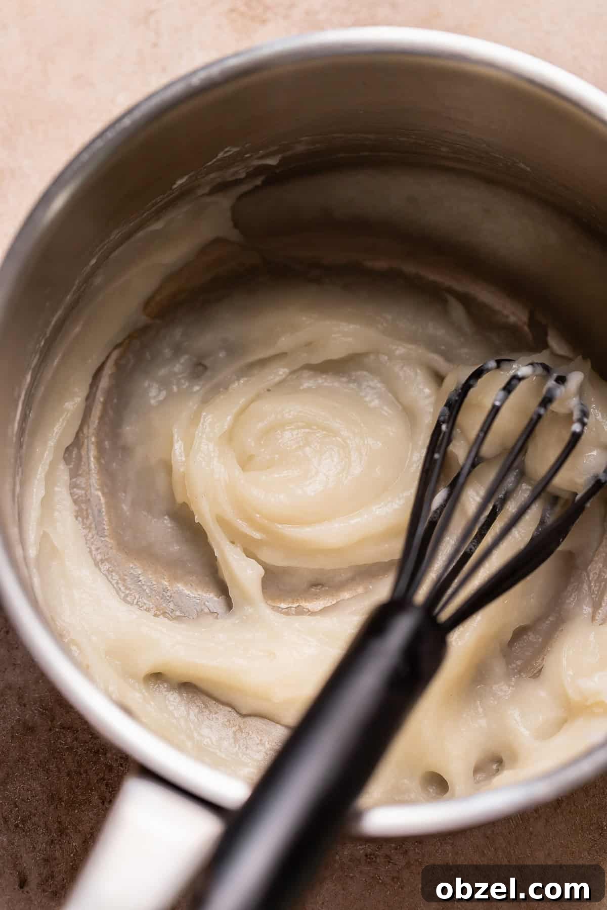 Strawberry Matcha Cinnamon Rolls Recipe 4 Tangzhong in a pot being whisked.