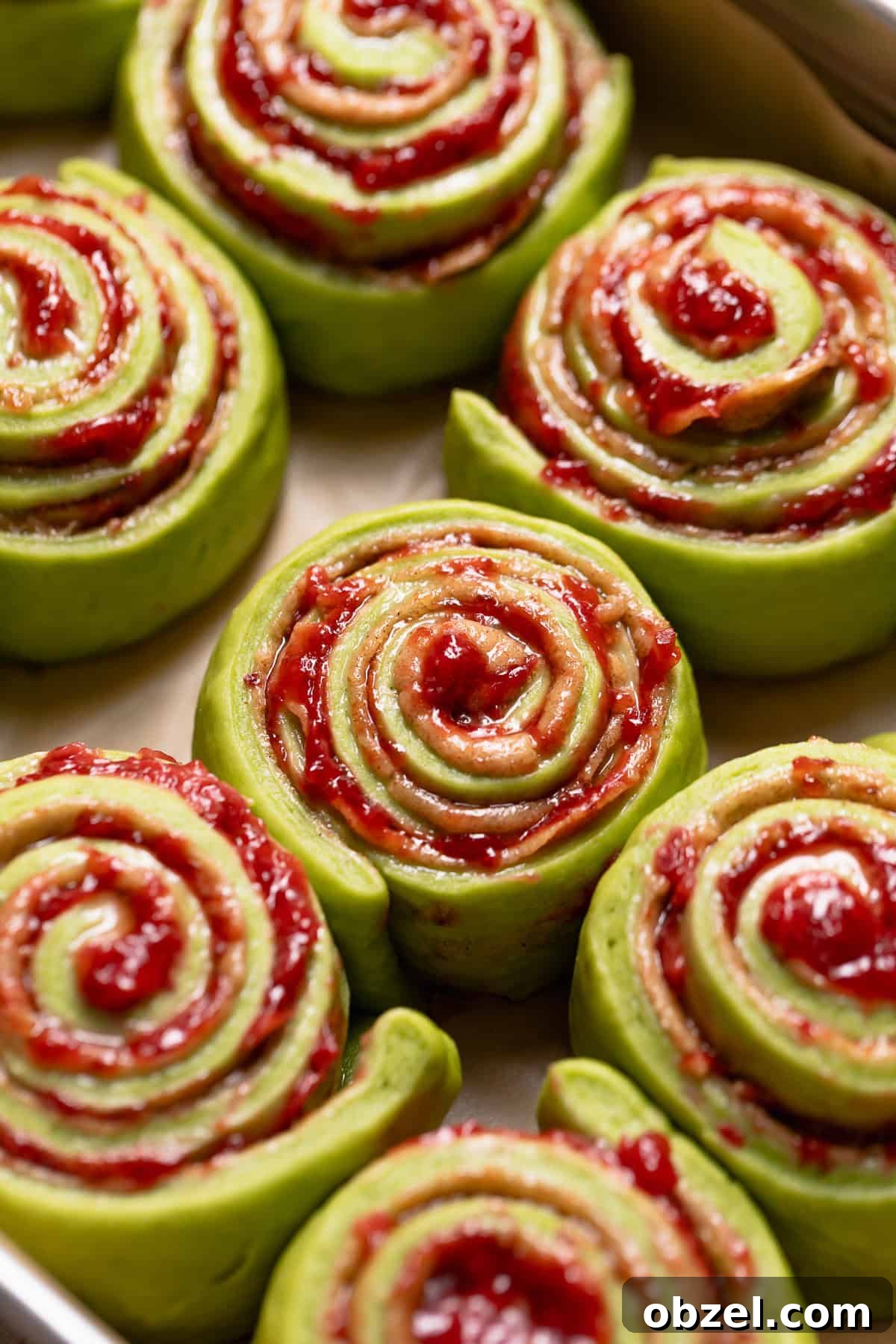 Strawberry Matcha Cinnamon Rolls Recipe 10 Matcha rolls doubled in size and ready to bake in a baking pan.
