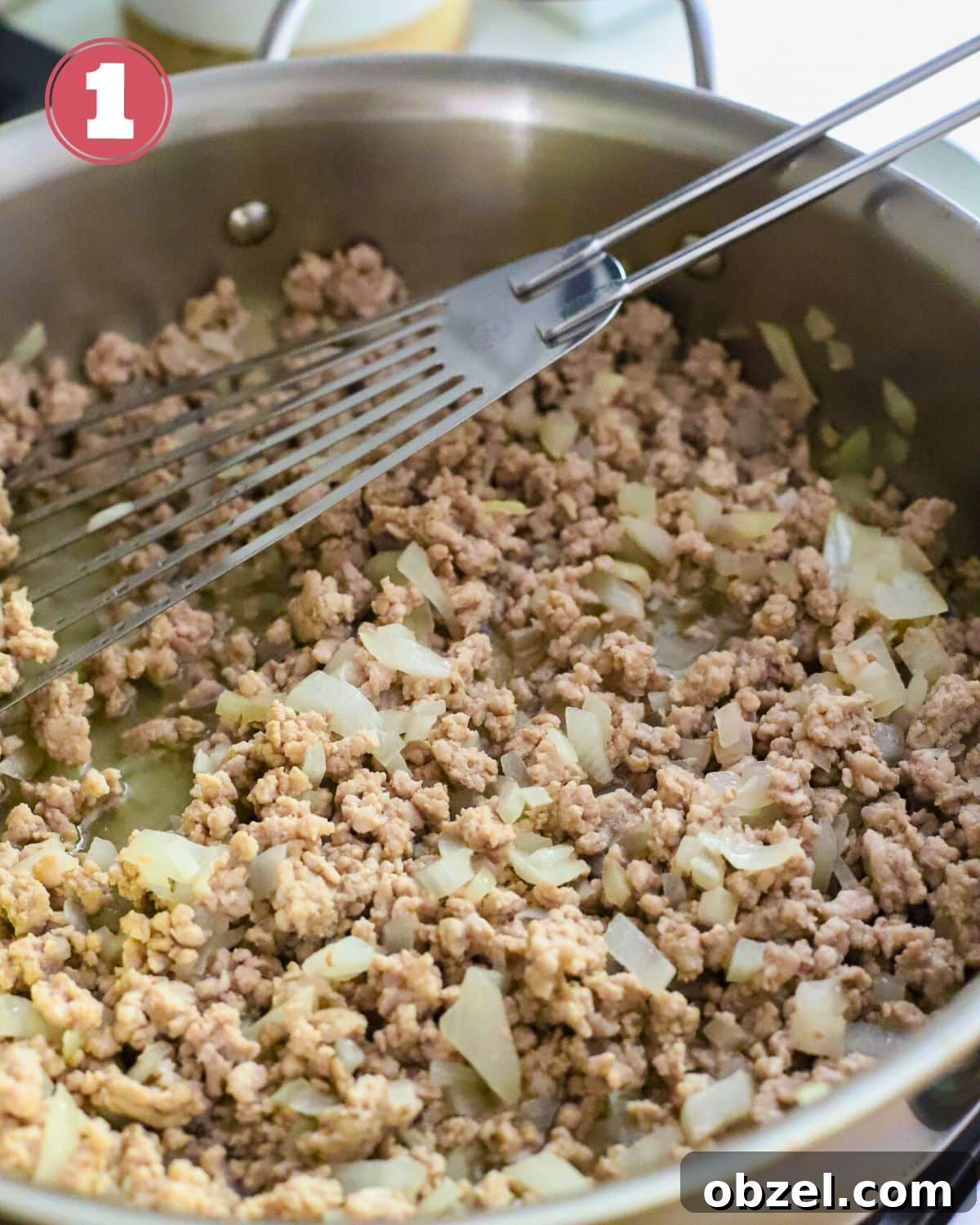 Slow Cooker Ground Pork Casserole Recipe 4 Ground pork and onions cooked in a skillet.