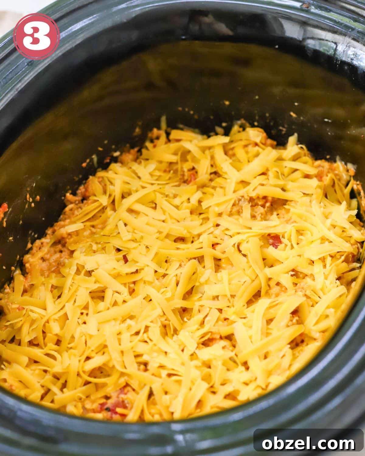 Slow Cooker Ground Pork Casserole Recipe 6 Ground pork casserole topped with cheese.