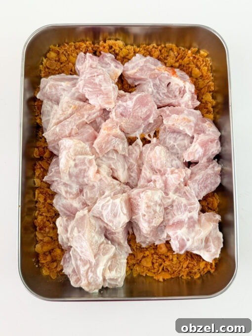 Chicken pieces coated in a seasoned cornflake crumb.